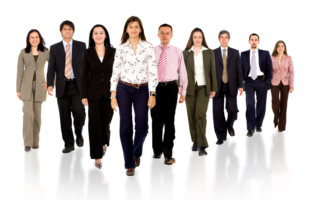 Business team walking forward - leadership and teamwork concepts using a group of businessmen and businesswomen isolated over a white background